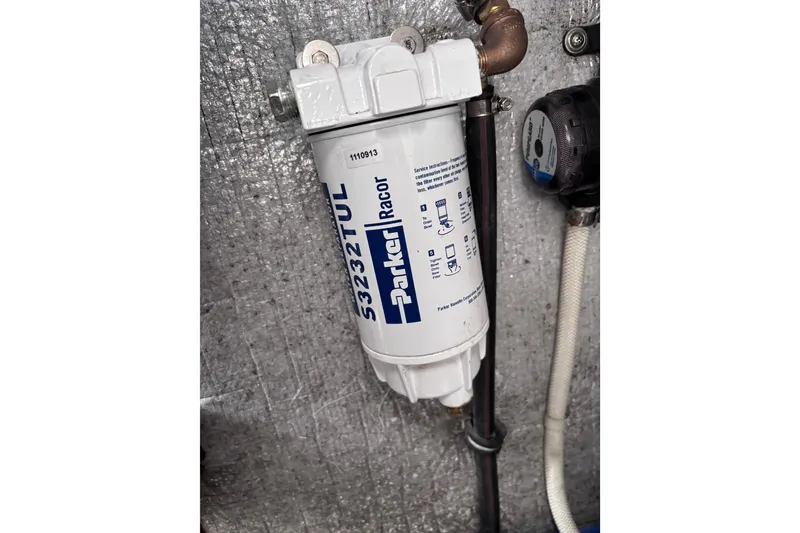 Slide: The Image of Parker Racor fuel filter in a 2007 Rinker EX 370 boat engine compartment. - 29