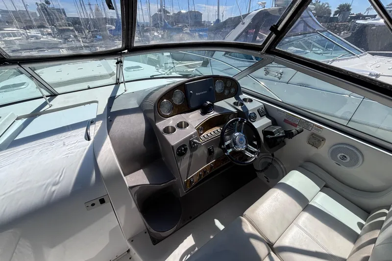 Slide: The Image of Cockpit of 2007 Rinker EX 370 boat with steering wheel and control panel. - 3