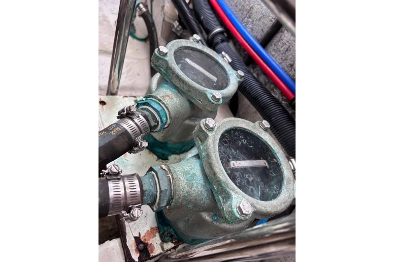 Slide: The Image of Close-up of two corroded marine engine components on a 2007 Rinker EX 370 boat. - 30