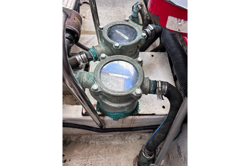 Slide: The Image of Engine compartment of a 2007 Rinker EX 370 boat showing mechanical components and hoses. - 31