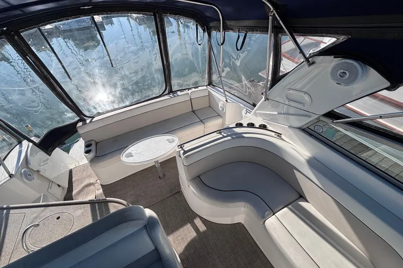 Slide: The Image of Spacious interior of 2007 Rinker EX 370 boat with elegant seating and table. - 5