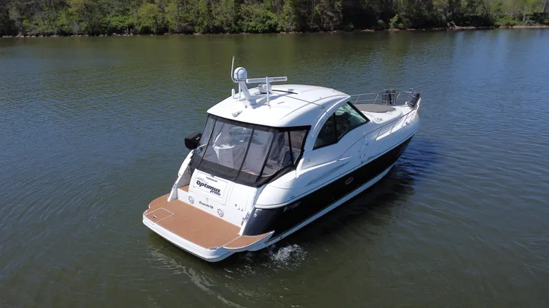 Slide: The Image of 2009 Cruisers Yachts 420 Sports Coupe on calm water, rear view. - 19