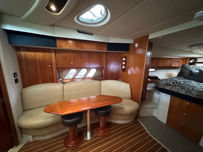 Slide: The Image of Interior of 2009 Cruisers Yachts 420 Sports Coupe with elegant seating and wooden finishes. - 29