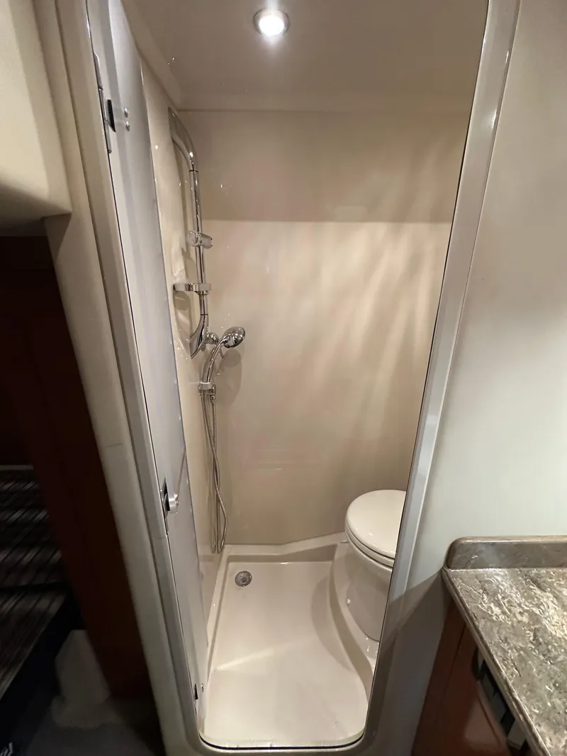Slide: The Image of 2009 Cruisers Yachts 420 Sports Coupe bathroom with shower and toilet. - 32