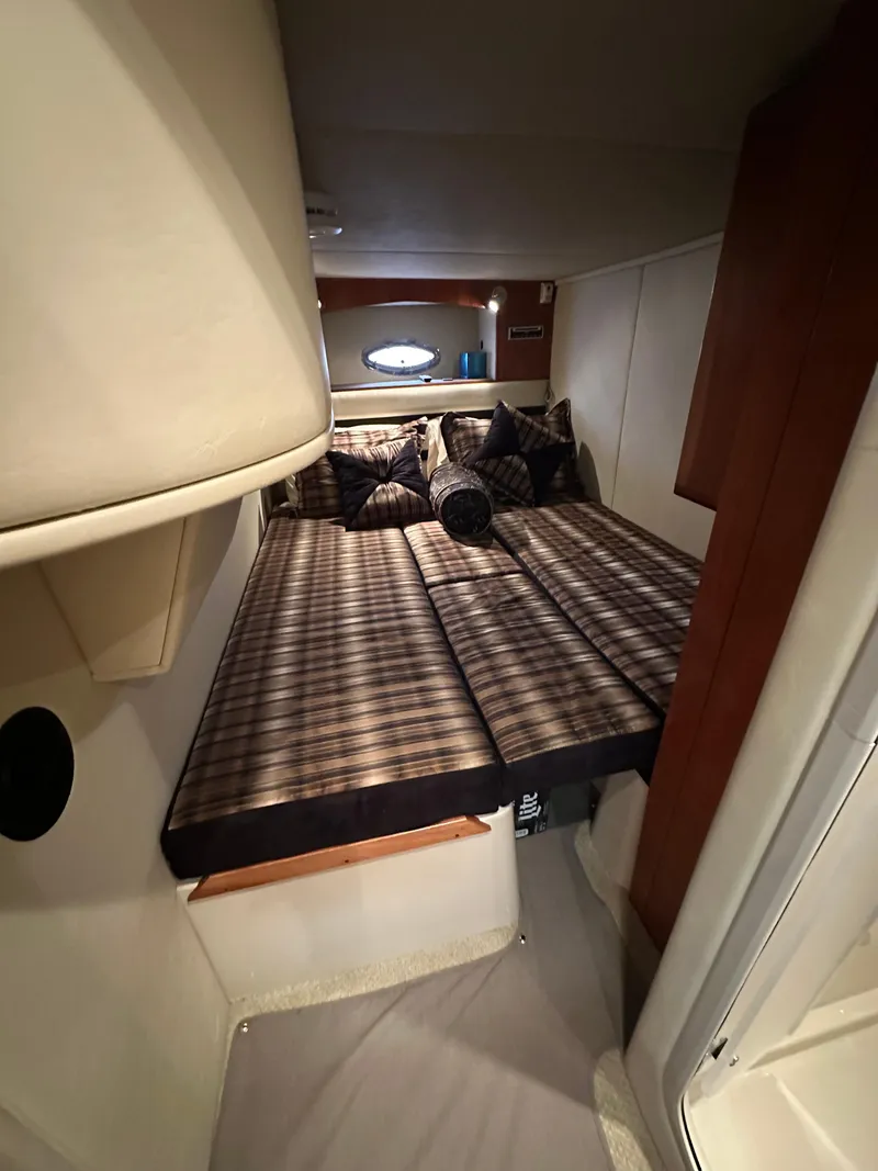 Slide: The Image of Interior cabin of 2009 Cruisers Yachts 420 Sports Coupe with plaid bedding. - 34