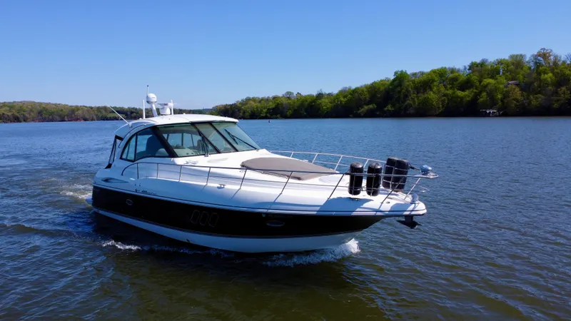 Slide: The Image of 2009 Cruisers Yachts 420 Sports Coupe cruising on a serene lake. - 4