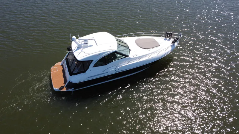 Slide: The Image of 2009 Cruisers Yachts 420 Sports Coupe on water, aerial view. - 8