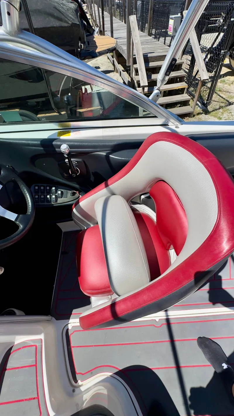 Slide: The Image of Interior of a 2005 Centurion Avalanche C4 boat with red and gray seating. - 12