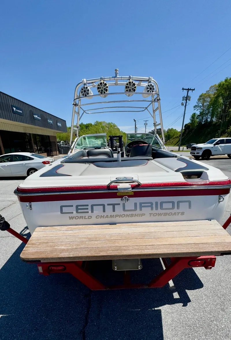 Slide: The Image of 2005 Centurion Avalanche C4 boat in parking lot, rear view. - 5