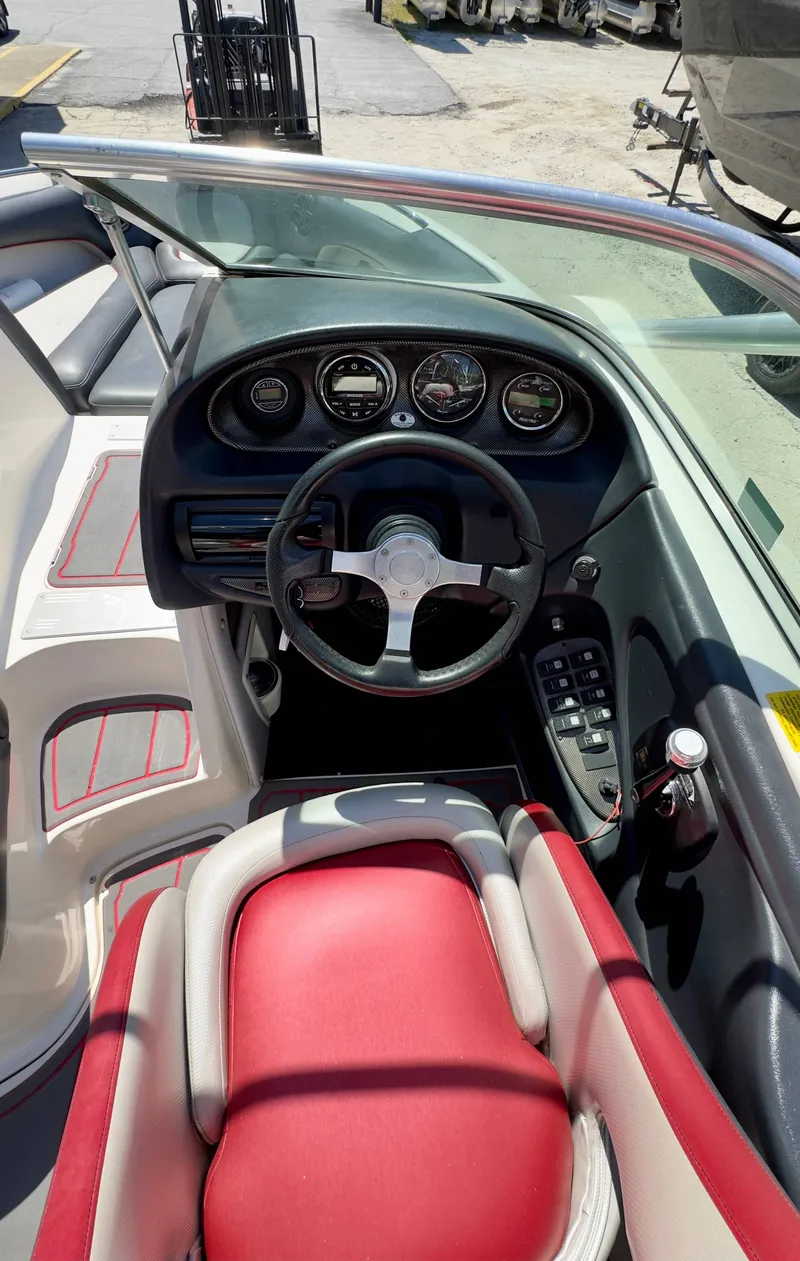 Slide: The Image of Interior of a 2005 Centurion Avalanche C4 boat with red seating. - 9