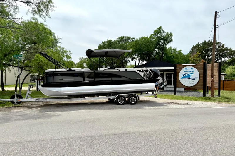 The Image of 2023 Barletta Corsa 23U pontoon boat on trailer at Elite Marine dealership. - 1