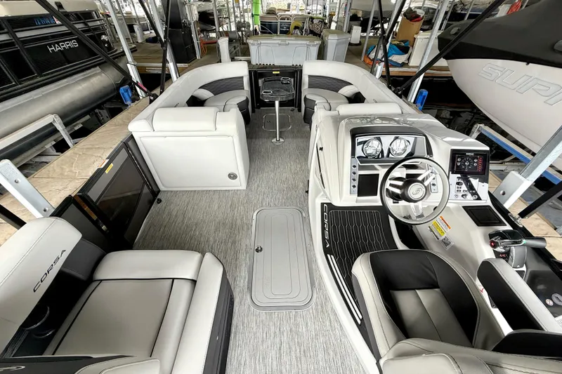 Slide: The Image of 2023 Barletta Corsa 23U pontoon boat interior with modern dashboard and seating. - 14