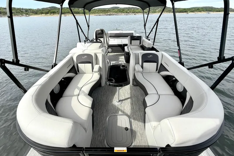 Slide: The Image of 2023 Barletta Corsa 23U pontoon boat with luxurious seating on a serene lake. - 15