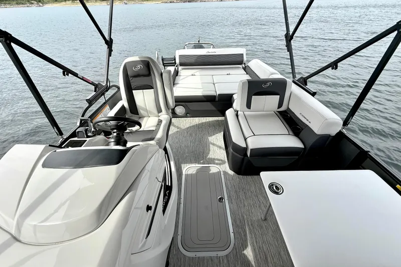Slide: The Image of 2023 Barletta Corsa 23U pontoon boat interior with luxurious seating and modern design. - 16