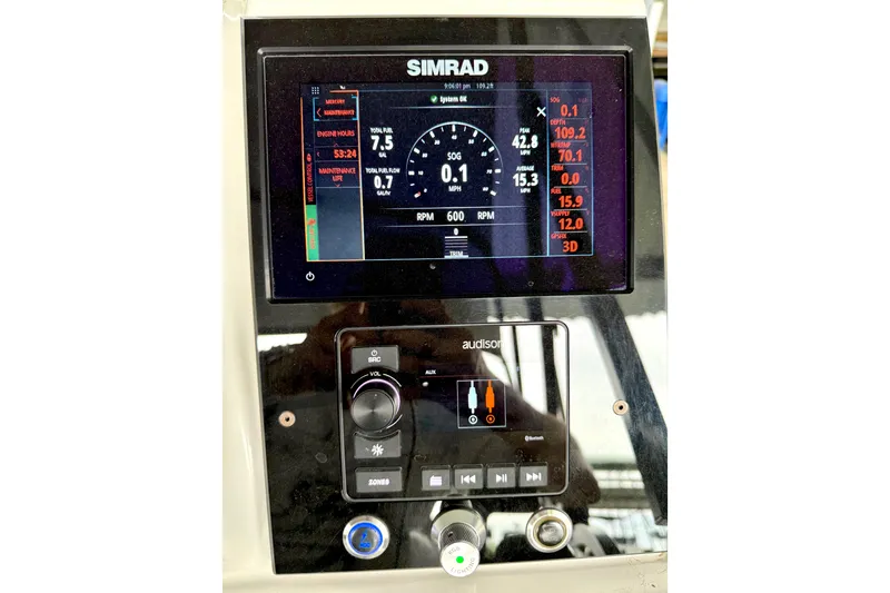 Slide: The Image of Simrad display on 2023 Barletta Corsa 23U showing engine metrics and controls. - 24