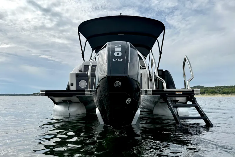 Slide: The Image of 2023 Barletta Corsa 23U pontoon boat with powerful V8 engine on a serene lake. - 5
