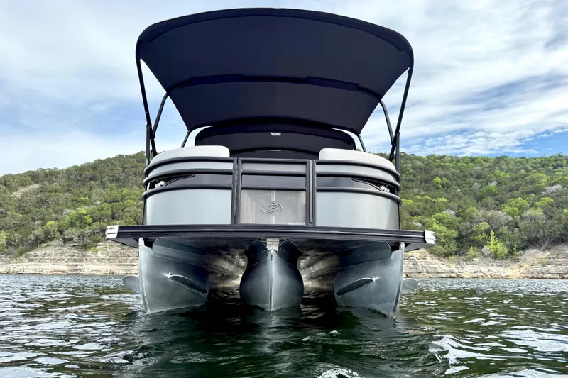 Slide: The Image of 2023 Barletta Corsa 23U pontoon boat on water, scenic background. - 9