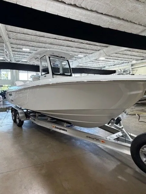 Slide: The Image of 2026 Everglades 285 Center Console boat on trailer in warehouse. - 17