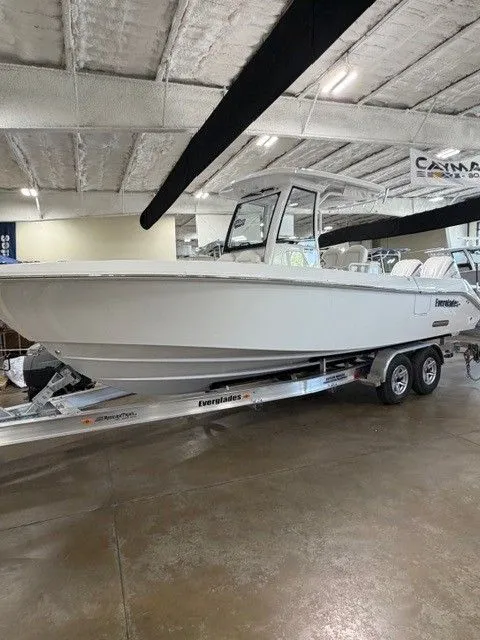 Slide: The Image of 2026 Everglades 285 Center Console boat on trailer in warehouse. - 8