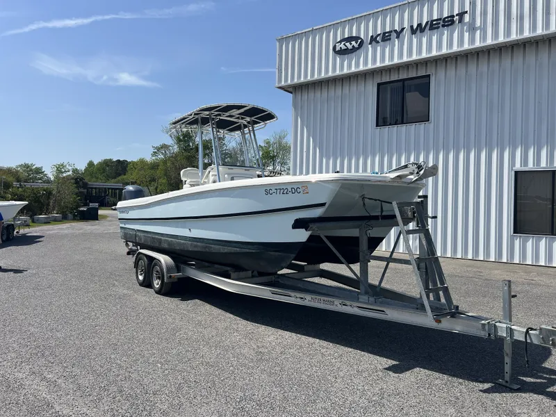 The Image of 2015 Carolina Cat 23CC boat on trailer outside Key West building. - 1