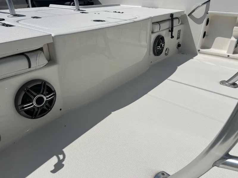 Slide: The Image of Interior of a 2015 Carolina Cat 23CC boat with speakers. - 5