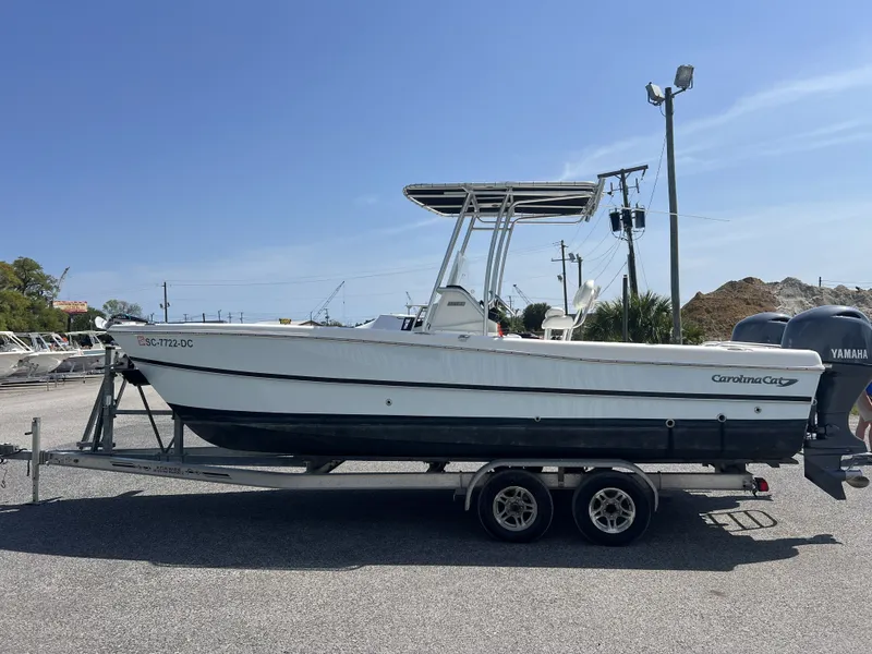 Slide: The Image of 2015 Carolina Cat 23CC boat on trailer outdoors. - 7
