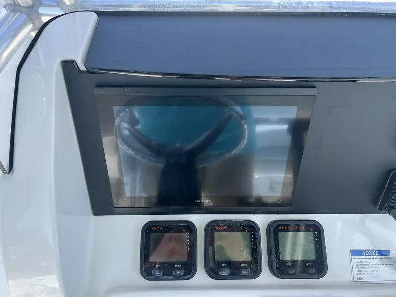 Slide: The Image of Dashboard of a 2015 Carolina Cat 23CC with Garmin display. - 8