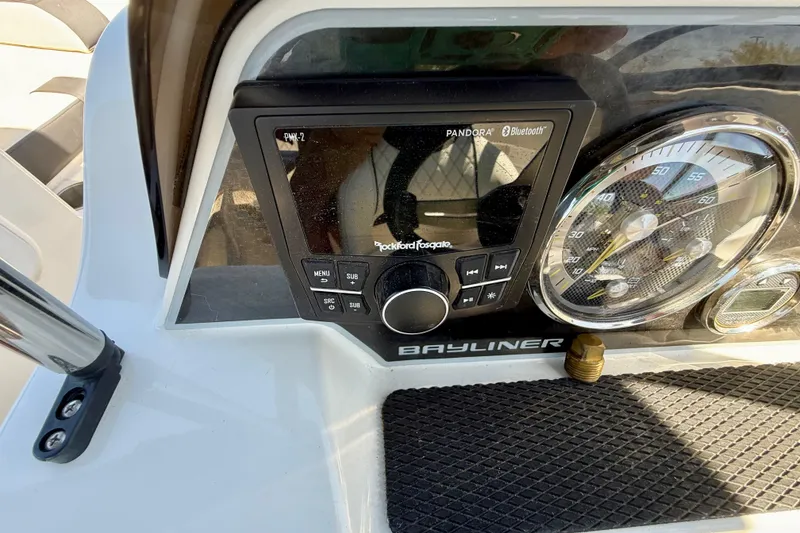 Slide: The Image of Dashboard of 2023 Bayliner DX 2050 with Rockford Fosgate audio system and speedometer. - 12
