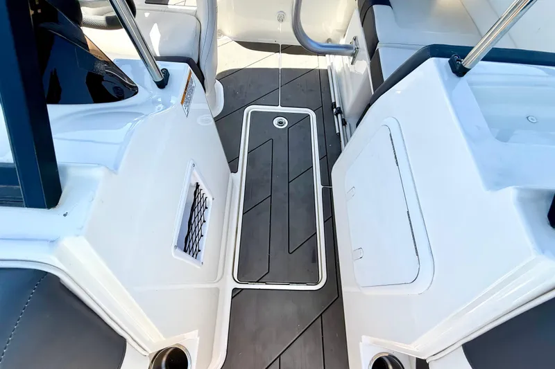 Slide: The Image of Interior view of 2023 Bayliner DX 2050 boat, featuring sleek seating and modern design elements. - 18