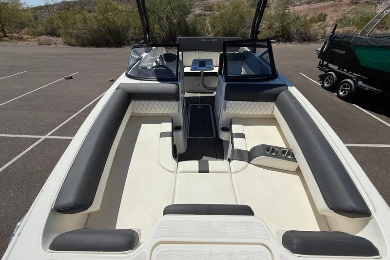 Slide: The Image of 2023 Bayliner DX 2050 boat interior with spacious seating and modern design. - 6
