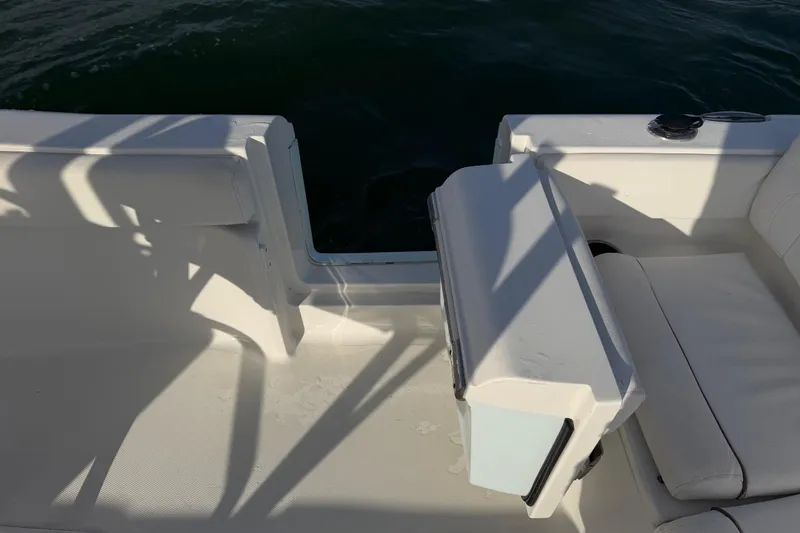 Slide: The Image of 2018 Sea Hunt Ultra 235 SE boat interior with seating and water view. - 54