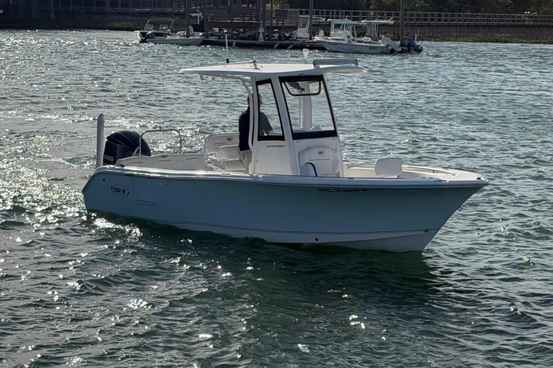 Slide: The Image of 2018 Sea Hunt Ultra 235 SE boat cruising on a sunny day. - 6