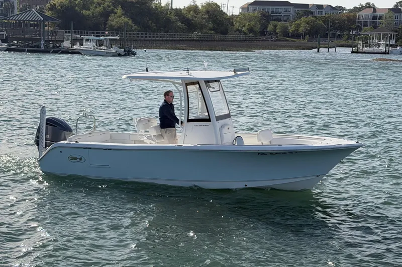 Slide: The Image of 2018 Sea Hunt Ultra 235 SE boat cruising on a sunny day. - 7