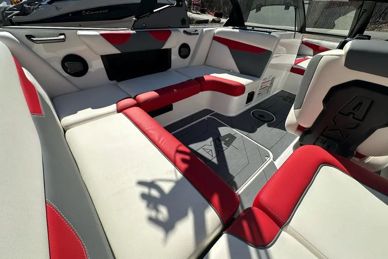 Slide: The Image of 2024 Axis A20 boat interior with red and white seating, showcasing modern design and comfort. - 11