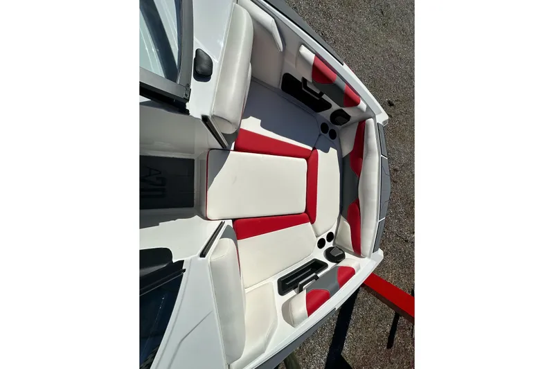 Slide: The Image of 2024 Axis A20 boat interior with red and white seating, showcasing modern design. - 13