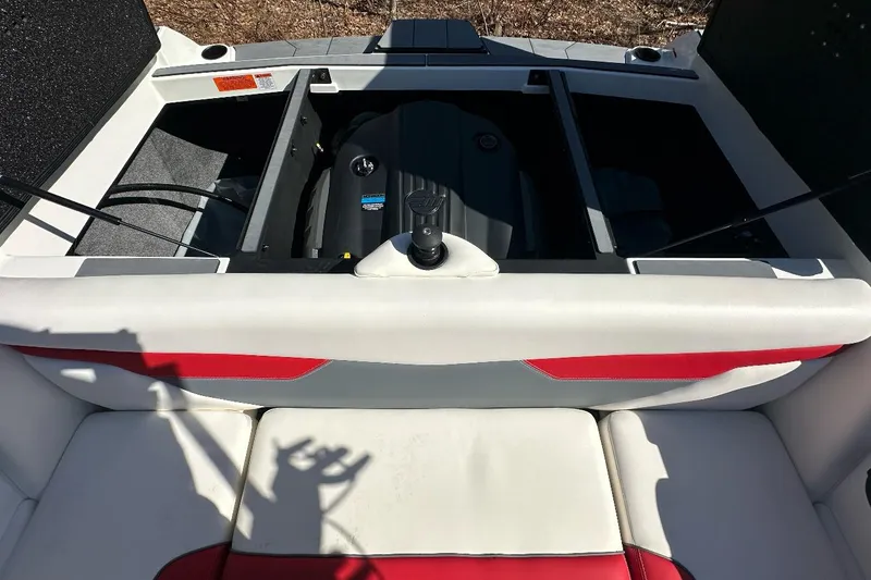 Slide: The Image of 2024 Axis A20 boat engine compartment with open hatch, showcasing interior details. - 18