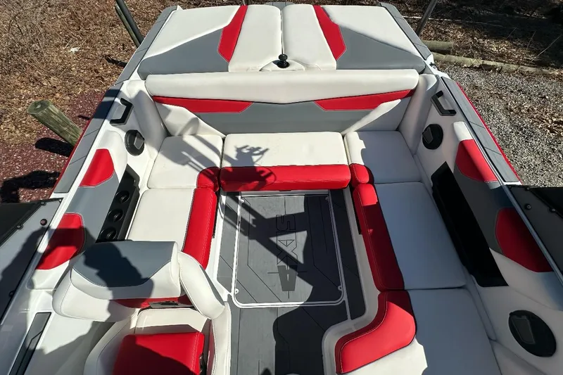 Slide: The Image of 2024 Axis A20 boat interior with red and gray seating, showcasing modern design. - 9
