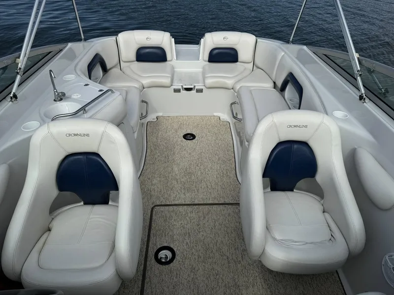 Slide: The Image of Interior of a 2003 Crownline 270 BR boat with white seating. - 11