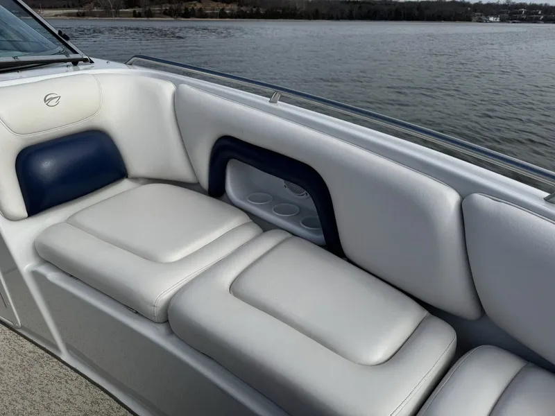 Slide: The Image of Interior of a 2003 Crownline 270 BR boat with white seating. - 18