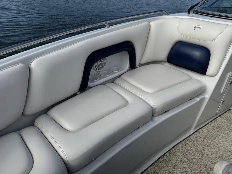 Slide: The Image of Interior of a 2003 Crownline 270 BR boat with white seating. - 19