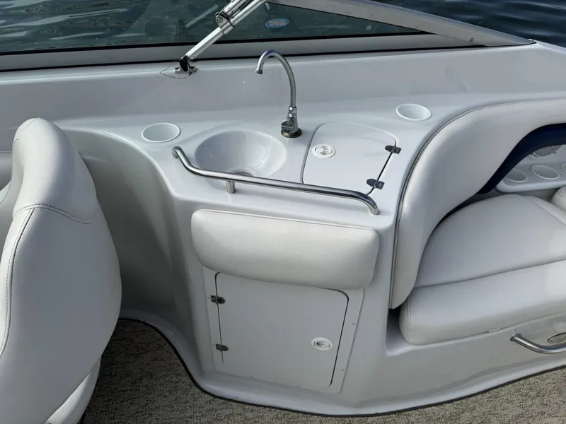 Slide: The Image of Interior of a 2003 Crownline 270 BR with sink and seating area. - 21