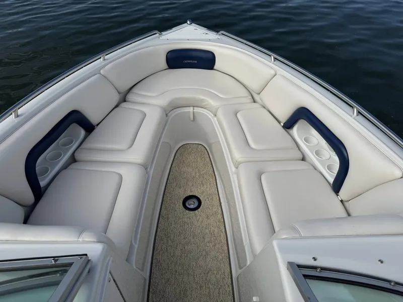Slide: The Image of Interior view of a 2003 Crownline 270 BR boat with beige seating. - 24