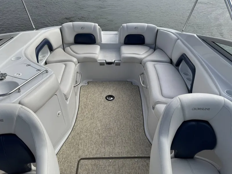 Slide: The Image of Interior of a 2003 Crownline 270 BR boat with gray seating. - 26