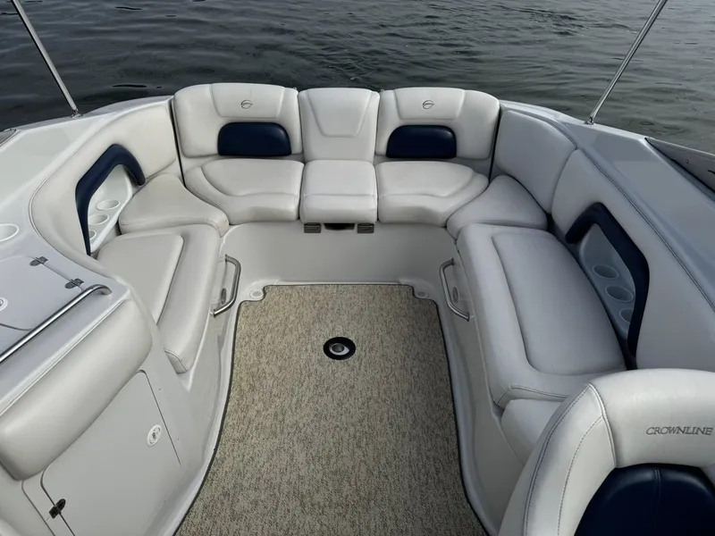 Slide: The Image of Interior of a 2003 Crownline 270 BR boat with white seating. - 27