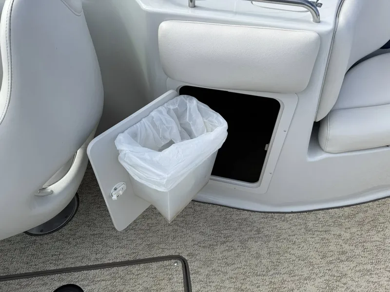Slide: The Image of Crownline 270 BR 2003 boat with built-in trash bin. - 4