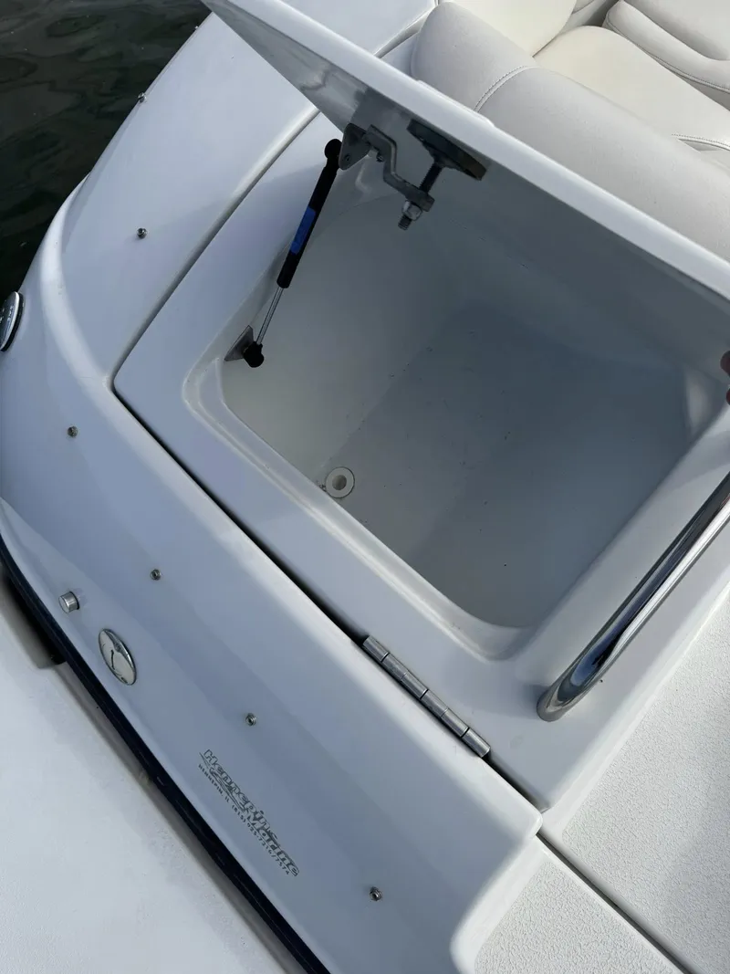 Slide: The Image of Open storage compartment on a 2003 Crownline 270 BR boat. - 6