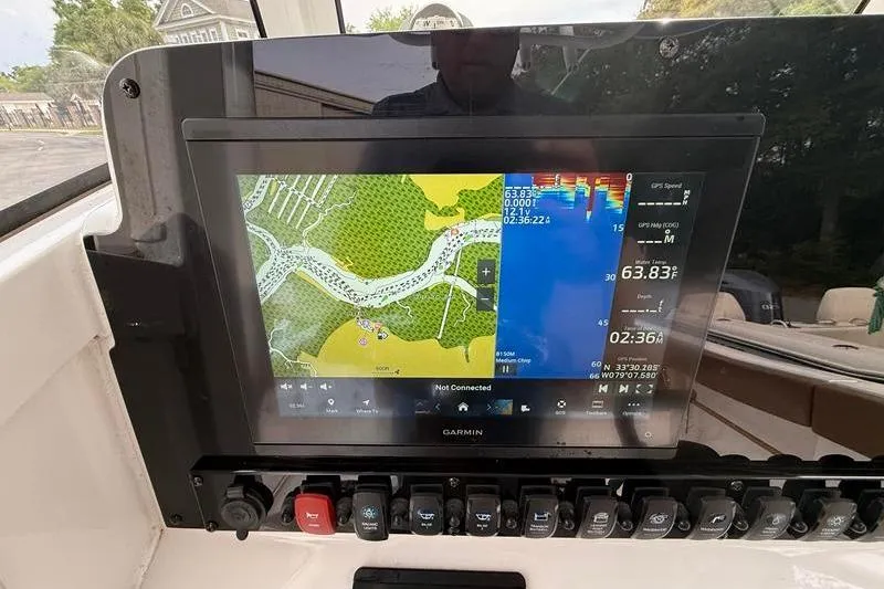 Slide: The Image of Garmin navigation display on 2023 Sea Hunt Ultra 255 SE boat dashboard. - 23