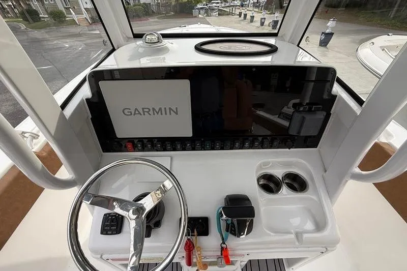 Slide: The Image of 2023 Sea Hunt Ultra 255 SE boat dashboard with Garmin navigation system. - 27