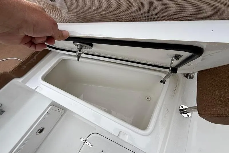 Slide: The Image of Open storage compartment on 2023 Sea Hunt Ultra 255 SE boat. - 33