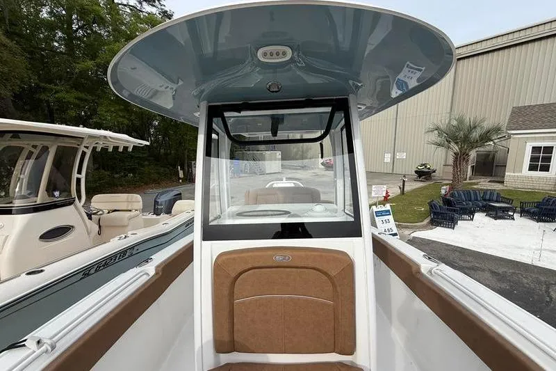 Slide: The Image of 2023 Sea Hunt Ultra 255 SE boat interior with console and seating. - 37